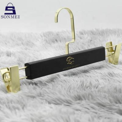 China Custom vintage black ashtree logo hangers wooden trouser hangers for trousers for sale