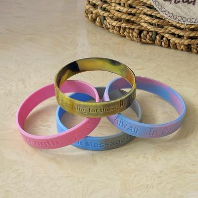 China Custom printed silicone wristbands with Debossed logo or text for sale