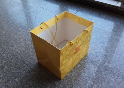 China High Grade Custom Gift Bags With Logo , Yellow Color Printed Gift Bags for sale