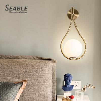 China New Listed Contemporary Bronze Milky White Bronze Indoor Glass Bedroom Metal Decoration Modern LED Living Room Wall Lamp for sale