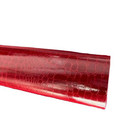 China Waterproof Glossy Embossed Crocodile Texture Faux Leather Roll Synthetic Leather Opens Fabric For Handbags Red Morocco Paper for sale