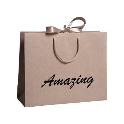 China Recyclable Customized Logo Hot Foiled Stamping Black Matt Kraft Paper Bag With Cotton Rope Handles for sale