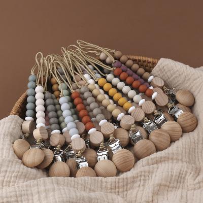 China Hot New Arrivals BPA Amazon Sale Baby Soother Clip Beech Free Wooden Baby Pacifier Dummy Chain Clip With Baby Teether for sale