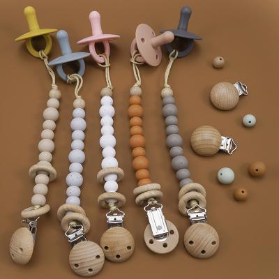 China Baby Feeding Success Soothe Relief Silicone Washable Rubber Ratchets Newborn Photography Props Organic Gorgeous Set Dummy Chain for sale