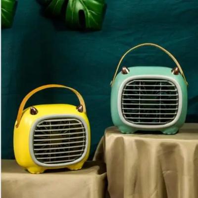 China Protable New Cartoon Monster Spray Humidification Cold Portable Desktop Fan USB Rechargeable Fan Car Small Fan for sale