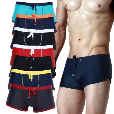 China Fashion breathable trend a variety of color collocation beach briefs men's youth beach swimming trunks waterproof sexy bikini bottom for sale