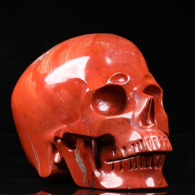 China South Africa Wholesale 8.0inch Natural Hand Carved Skulls Red Jasper Crystal Skulls Healing Natural Crystal Skulls for sale