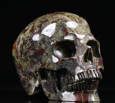 China Europe High Quality 5.0 Inch Dragon's Blood Hollow Stone Carved Crystal Skulls Healing Crystal Skulls Wholesale Gemstone Skulls for sale