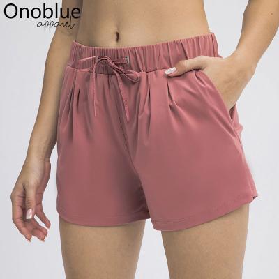 China 2021 Breathable Low Waist Workout Gym Leisure Running Shorts Women Drawstring Training Fitness Sport Pocket Sweaty Naked Feeling Shorts for sale