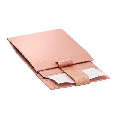 China Handmade Custom Printing Pink Magnetic Paper Flat Folding Packaging Gift Box With Ribbon for sale