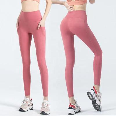 China New Breathable Gym Women Seamless Pants With Pocket Fitness Yoga Wear Plus Size Sports Tracksuit Yoga Gaiters Tiktok Gaiters Yoga Pants for sale