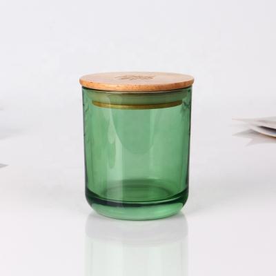 China Home Decoration Luxury 10oz Colored Green Glass Candle Jar With Wooden Lid for sale