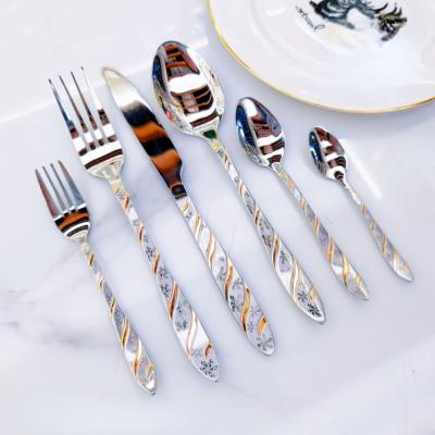 China Factory stocked direct gold plated stainless steel western tableware headed tail laser pattern hle meal knife fork spoon coffee head for sale