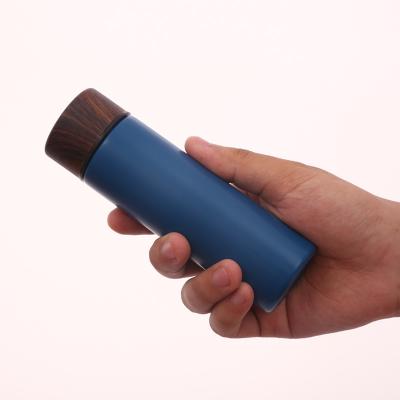 China Viable Mini Cute Wood Grain Thermos Cup Creative Small Cool Portable Pocket Outdoor Thermos Water Sensitive Mug for sale