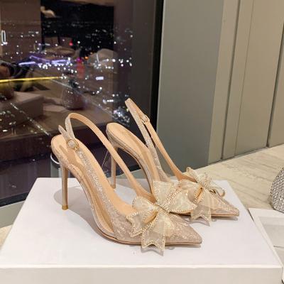 China Fashion trend new style thin heel headed bridal shoes rhinestone bow material bow glitter after glue high heels empty glass sandals for sale