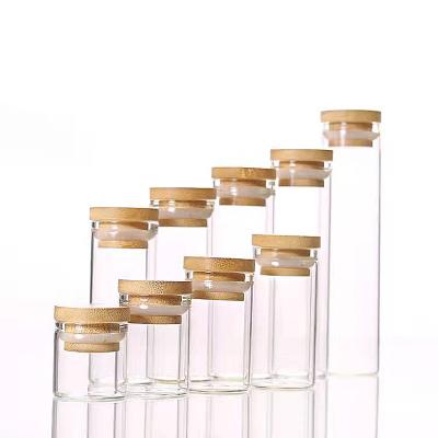 China Food Wide Mouth Round Borosilicate Food Container Jar Glass Tubes With Bamboo Lid for sale