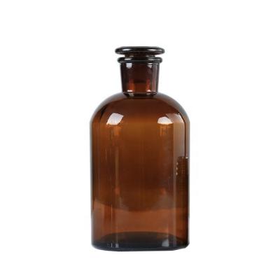 China Narrow Mouth Amber Reagent Glass Medicine Bottles With Glass Lid 60ml 125ml 250ml 500ml 1000ml for sale