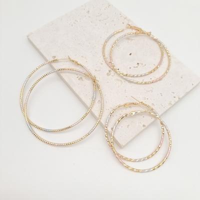 China TRENDY 50mm 60mm 70mm custom tricolor punk exaggerated slim women big gold filled hoop earrings for sale