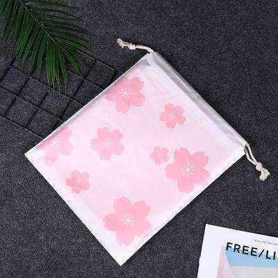 China Fashion Recyclable Printed Flower Pink PE Drawstring Bag Plastic Durable Clothing Storage Plastic Bags for sale