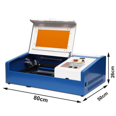 China Water Cooled Professional Laser Engraving Machine 40W CO2 3020 Laser Cutting Machine With Exhaust Fan USB Port for sale