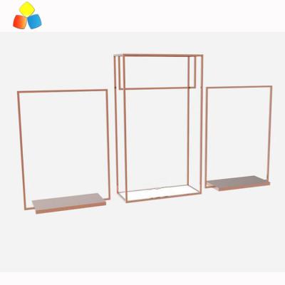 China MDF Zara Golden Clothes Display Rack with Shelves for Retail Store Metal Display Rack for sale