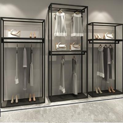 China Floor Standing Fashion Retail Store Design Clothing Store Fixtures Of Display Shelves for sale