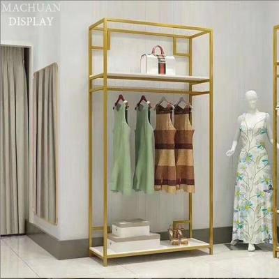 China Floor Standing Luxury Brass Marble Shoes Rack Shiny Store Fixtures For Bags for sale