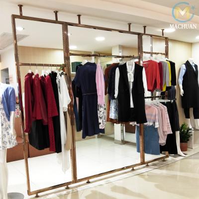 China Floor Standing Brass Metal Rack Display Stand For Hanging Clothes for sale