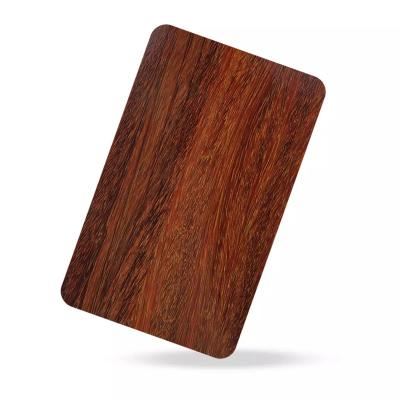 China Suitable for wall decoration red sandalwood grain panel laminate stainless steel transfer plate sheet for hotel door wardrobe 201 decorative plate production for sale