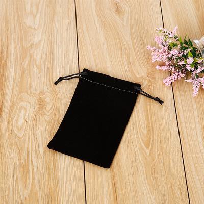 China Small black velvet fabric jewelry pouches with drawstring for sale