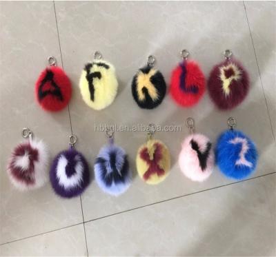 China Fur Pom Poms Key Ring Alphabet Design Keychians Fur Pompom Ball Custom Colorful Letter Pendant New for sale