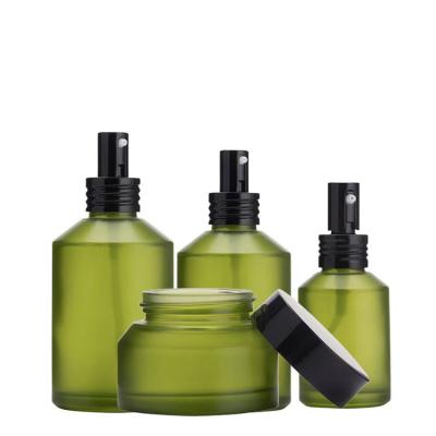 China Cosmetic Slant Shoulder Frosted Olive Green Glass Bottle 15ml 30ml 60ml Cosmetic Serum Glass Bottle 100ml And 30g 50g Face Cream Jars for sale