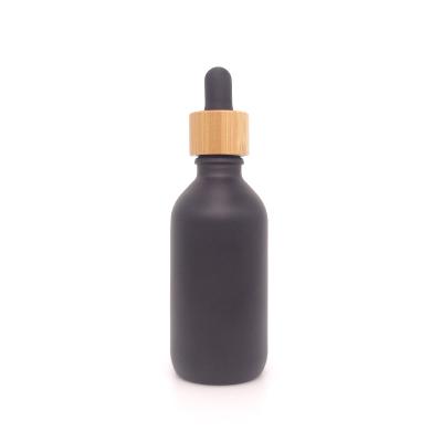 China Personal Care 60ml Matte / Frosted Black Glass Dropper Bottle With Bamboo Lid 18mm Neck Height for sale