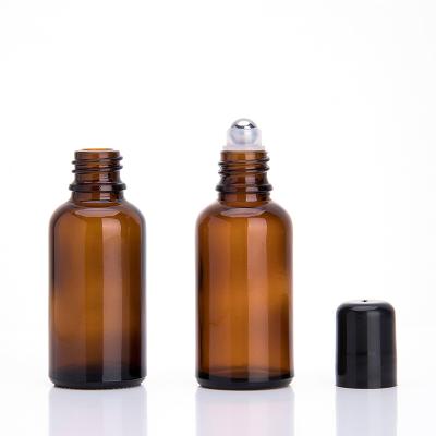 China Recyclable Amber Glass Essential Oil 30ml Stainless Steel Rollball Bottle for sale