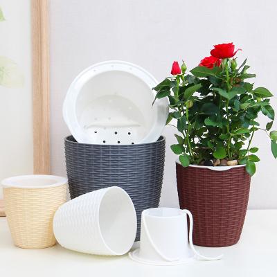 China Cheap and hot sales biodegradable imitate rattan woven type with self watering lazy flowerpot for sale