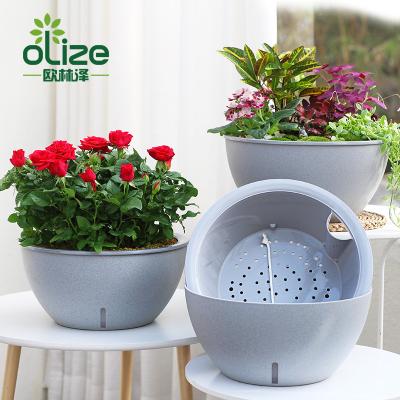 China Wholesale New Europe Style Fashionable Gray Round Self Watering Plastic Flower Pot for sale