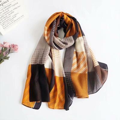 China 2021 new design new design multifunctional plaid muslim female squishy millbird geometric cotton shawl polyester scarf for sale