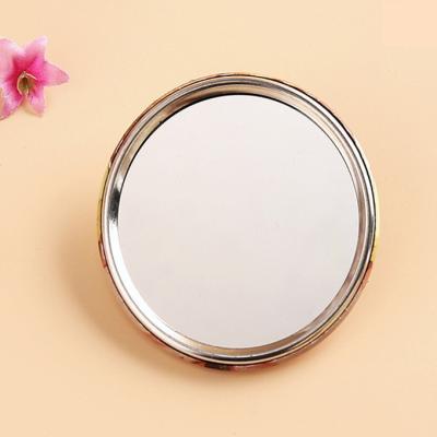 China Low Price Handheld Mirror Advertising Mirror Iron Frame Case Pocket Round Hand Enlarging Cosmetic Moon Make Up Mirror for sale