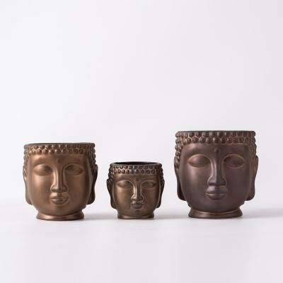 China Contemporary Matte Metal Kiln Glazed Ceramic Buddha Head Planting Decorative Flowerpot for sale