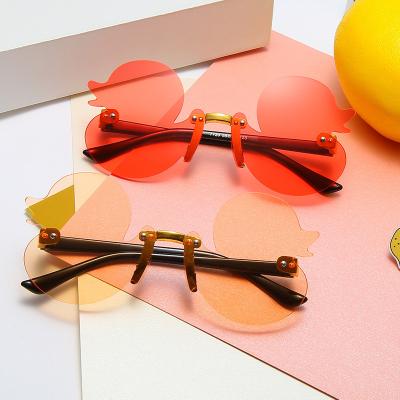 China 10 Years Experience 2022 New Duckling Yellow Duckling Frameless Cartoon Street Shooting Sunglasses Cute Baby Sunglasses for sale