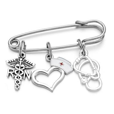 China Stainless Steel Heart Nurse Hat Charms Jewelry Caduceus Medical Stethoscope Nursing Brooches Pins Gift For Nurse Day for sale