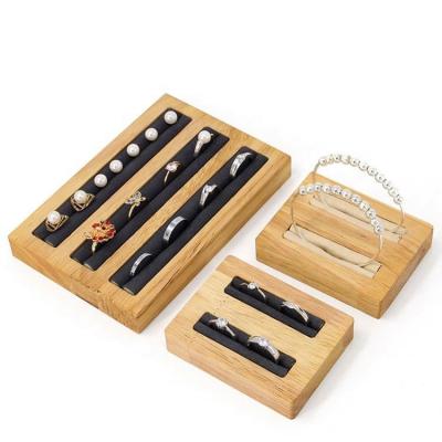 China Fashionable Wooden Velvet Jewelry Wedding Rings Bracelet Display Tray Set Luxury Display Shelf Black Wood for sale