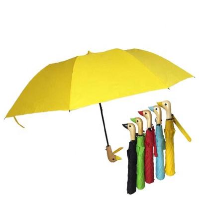 China Customized Colorful Advertising Logo Printing Duck Wooden Handle Strong Windproof Unique Products Shape Automatic Open 2 Folds Umbrella for sale