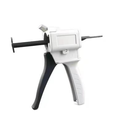 China tnew arrival sale plastic gun dental mixing dispensing gun dispense applicator impression gun for sale