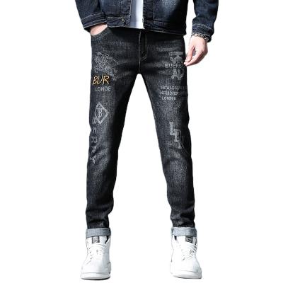 China QUICK DRY Mens Designer Pencil Jeans Letter Printed Black Denim Pants Fashion Club Wear For Male Hip Hop Skinny Jeans For Men for sale