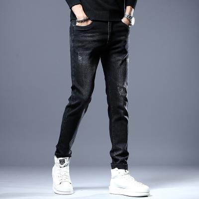 China QUICK DRY Mens Designer Pencil Jeans Letter Printed Black Denim Pants Fashion Club Wear For Male Hip Hop Skinny Jeans For Men for sale