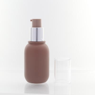 China Round Shape Beauty Base Cosmetic Pump Cap 30ml Luxury Skin Care Glass Bottle For Make Up for sale