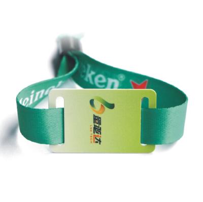 China Length adjustable Disposable identification woven label wrist strap polyester woven hand strap concert tickets colored cloth admission bracelet for sale