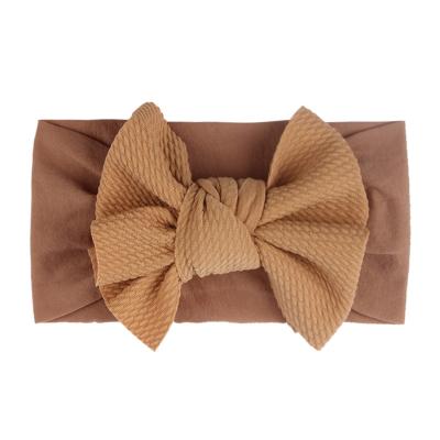 China Cute and Lovely Solid Color Infant Girls Soft Bow Hair Accessories Baby Hair Accessories Waffle Waffle Headbands Wholesale for sale