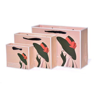 China Recyclable Custom Luxury Custom Packaging Boutique Ribbon Handle Ribbon Gift European Portable Paper Bag for sale